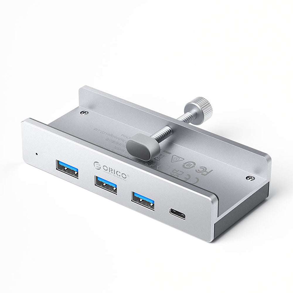„Orico MH4PC“ šakotuvas, montuojamas prie spaustuko, USB-C / 3x USB-A 3.0 + 1x USB-C 3.0 - sidabrinis
